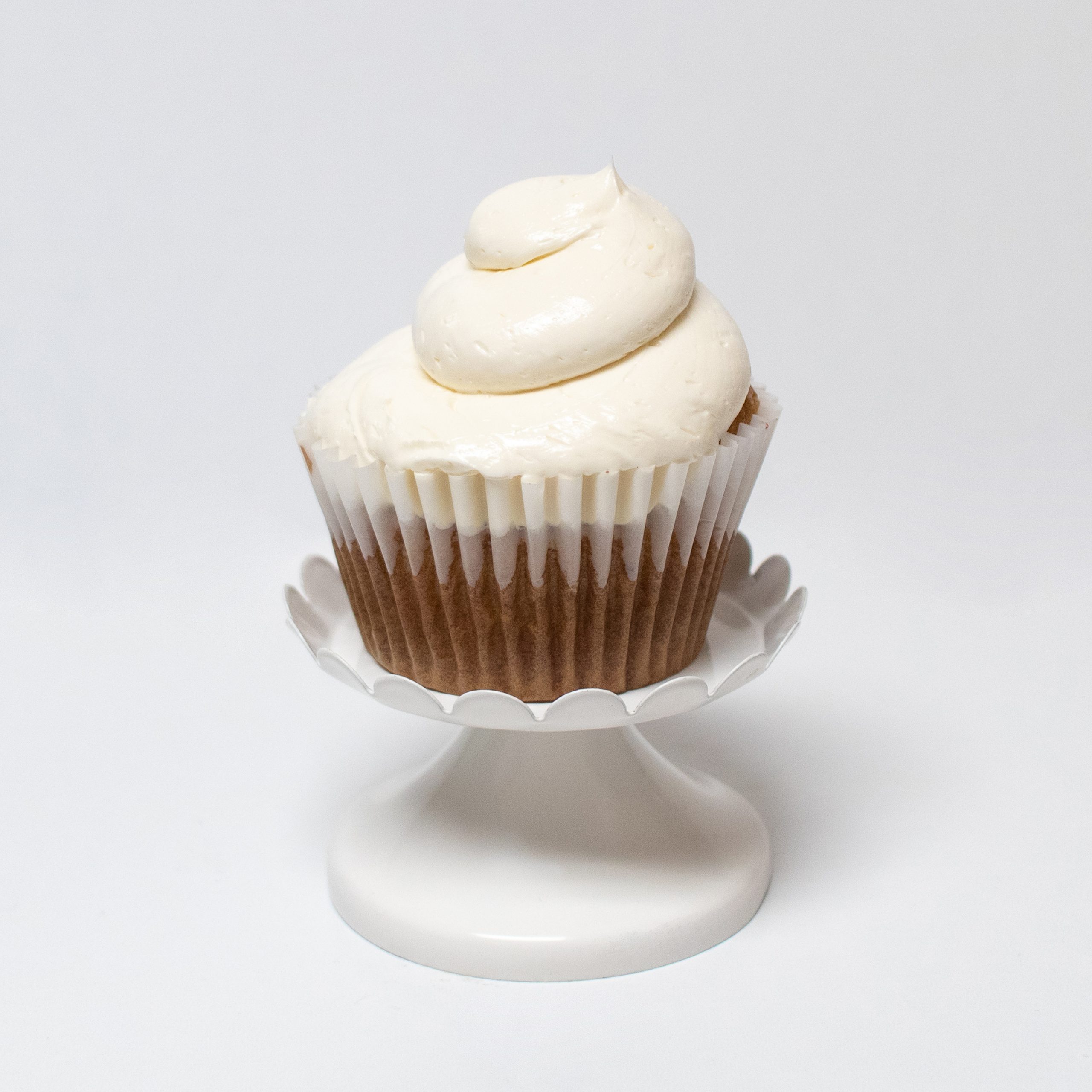 gluten free vanilla cupcake on white tray